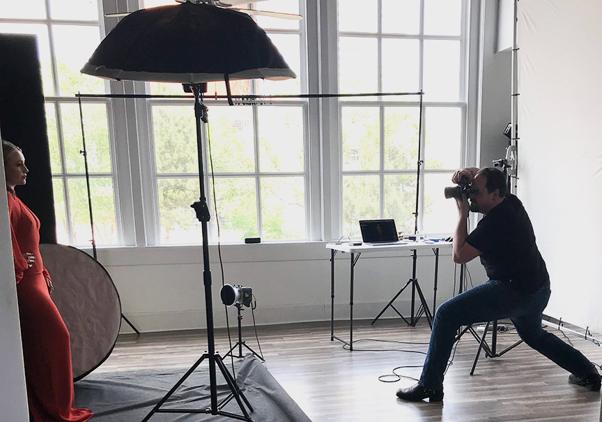 Headshot and portrait photographer Ben Marcum photographing a model in the studio using Paul C. Buff, Inc. lights.