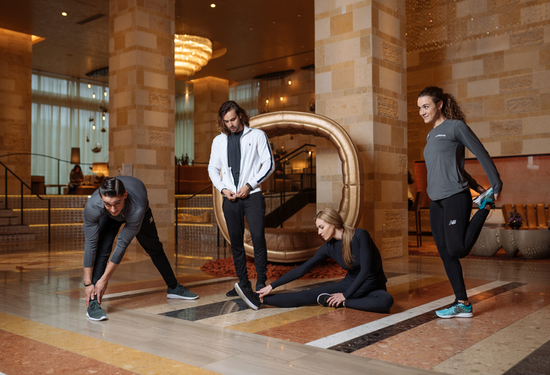 runWestin participants stretching in the lobby photographed by Tausha Dickinson.