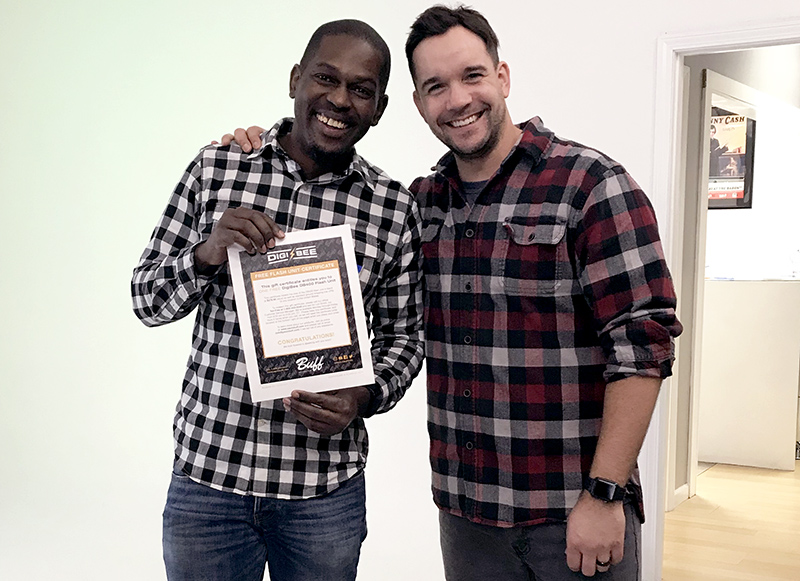 Jeff Carpenter of Readylight Media poses with Zuri Richards who had won a DigiBee DB400 at the Next Level Lighting Workshop.