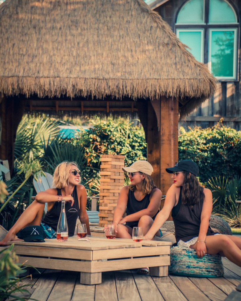 Jessica Wagner, of The Weekender blog, photographed by Robert Wagner, with family outside the Tribe Kelley Surf Post